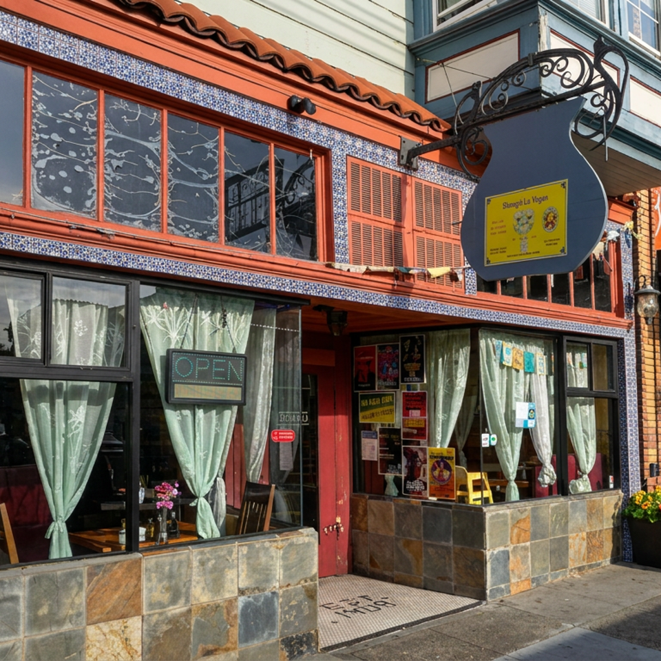 Colorful Burma Superstar restaurant storefront with blue mosaic tile trim, curtained windows, an open sign, and sidewalk planters.